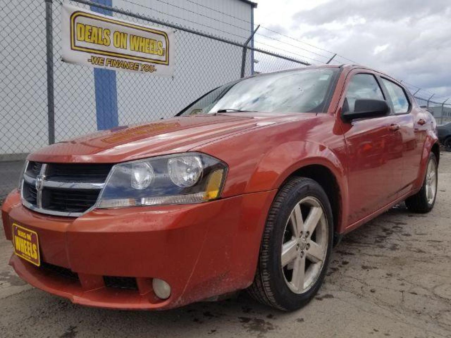 2008 Sunburst Orange Pear Dodge Avenger SXT (1B3LC56R08N) with an 2.7L V6 DOHC 24V FFV engine, 4-Speed Automatic transmission, located at 601 E. Idaho St., Kalispell, MT, 59901, (406) 300-4664, 0.000000, 0.000000 - Photo#0