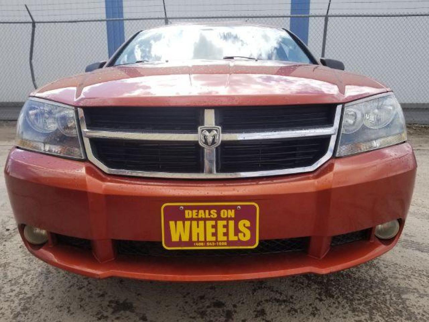 2008 Sunburst Orange Pear Dodge Avenger SXT (1B3LC56R08N) with an 2.7L V6 DOHC 24V FFV engine, 4-Speed Automatic transmission, located at 601 E. Idaho St., Kalispell, MT, 59901, (406) 300-4664, 0.000000, 0.000000 - Photo#1
