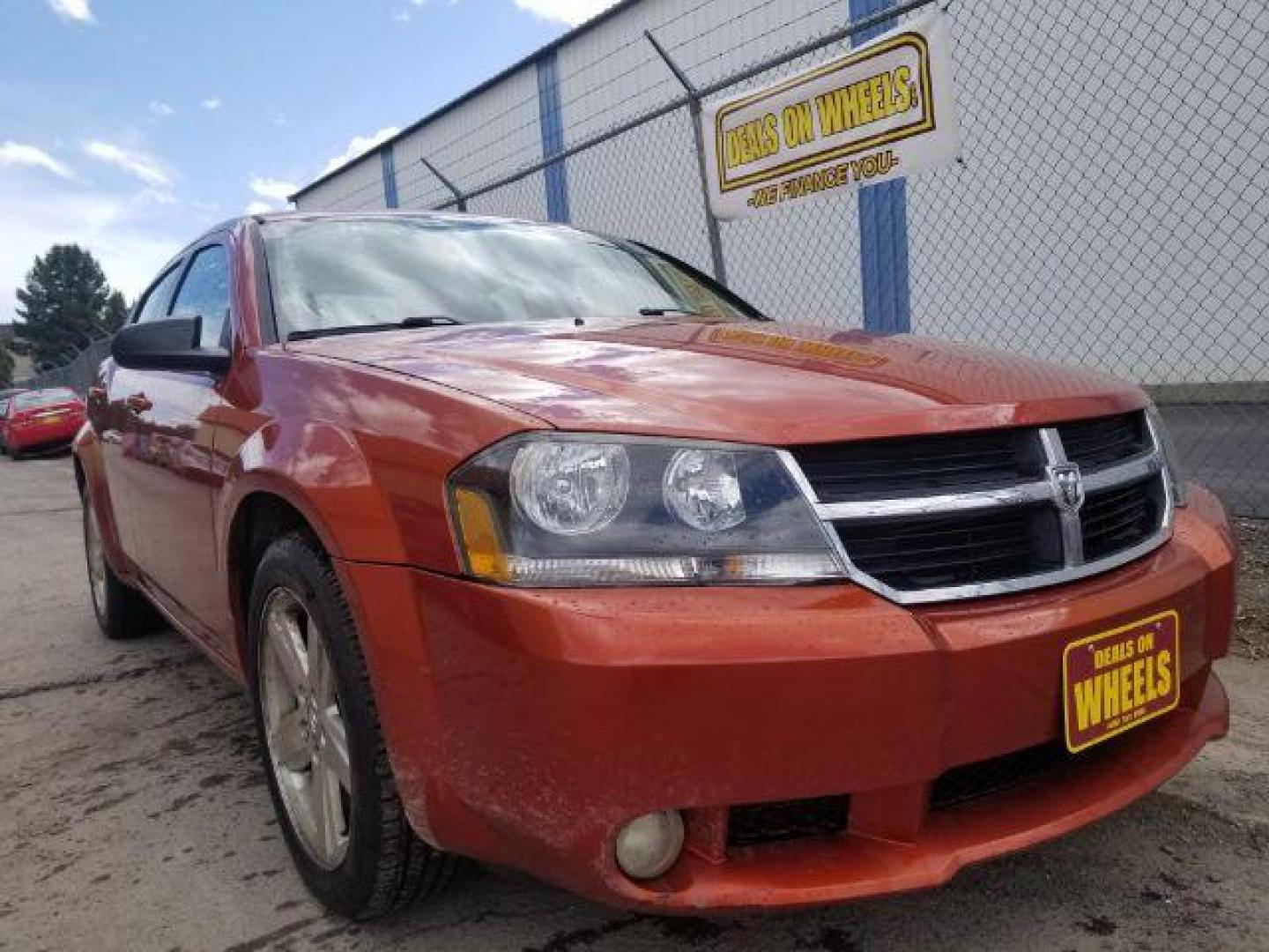 2008 Sunburst Orange Pear Dodge Avenger SXT (1B3LC56R08N) with an 2.7L V6 DOHC 24V FFV engine, 4-Speed Automatic transmission, located at 601 E. Idaho St., Kalispell, MT, 59901, (406) 300-4664, 0.000000, 0.000000 - Photo#2