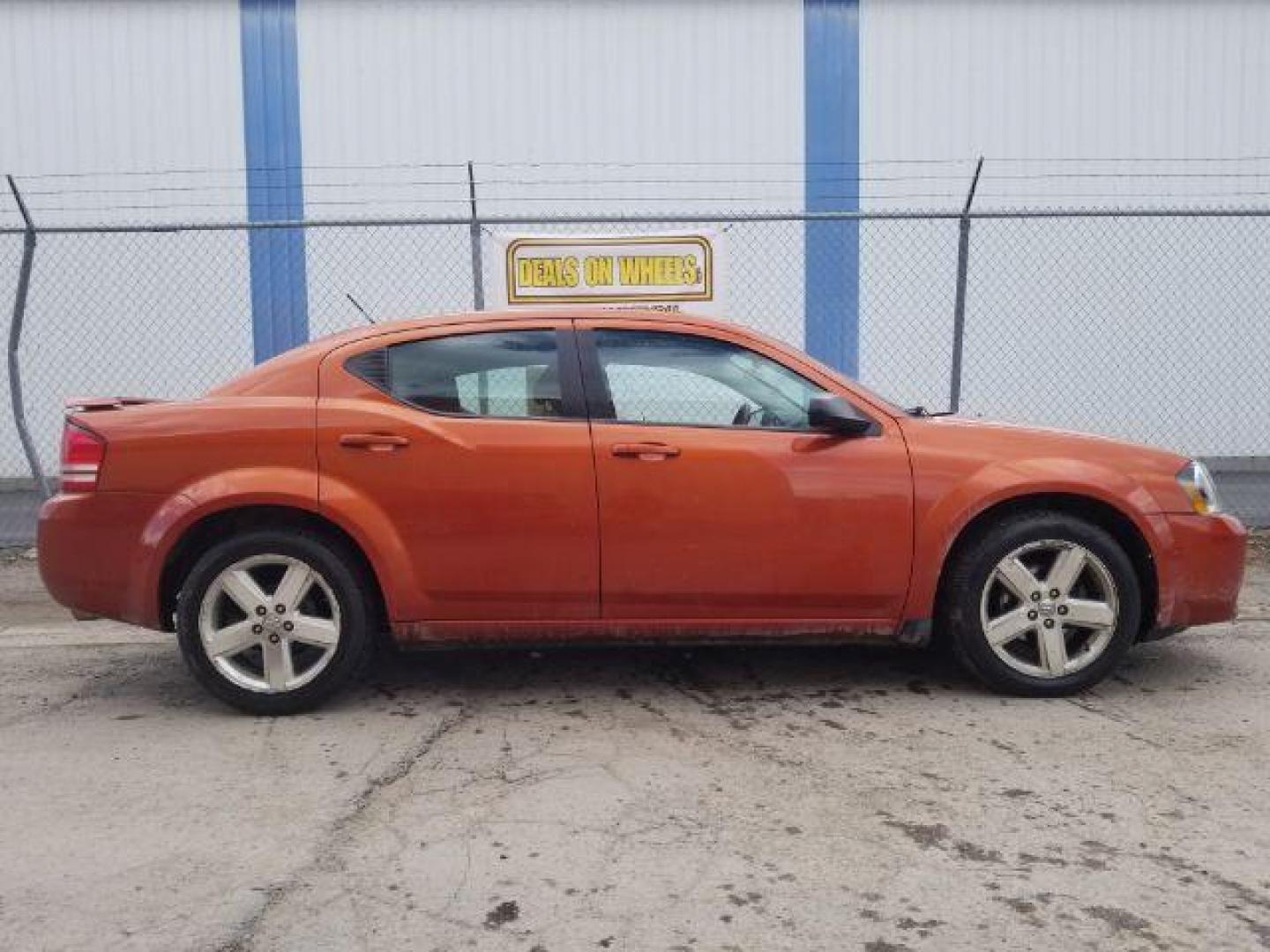 2008 Sunburst Orange Pear Dodge Avenger SXT (1B3LC56R08N) with an 2.7L V6 DOHC 24V FFV engine, 4-Speed Automatic transmission, located at 601 E. Idaho St., Kalispell, MT, 59901, (406) 300-4664, 0.000000, 0.000000 - Photo#3