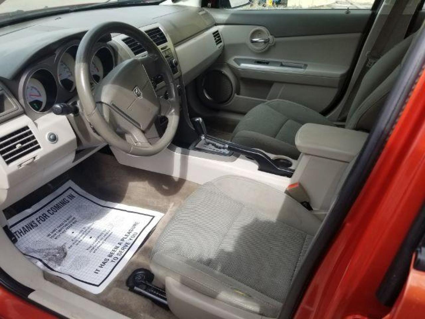 2008 Sunburst Orange Pear Dodge Avenger SXT (1B3LC56R08N) with an 2.7L V6 DOHC 24V FFV engine, 4-Speed Automatic transmission, located at 601 E. Idaho St., Kalispell, MT, 59901, (406) 300-4664, 0.000000, 0.000000 - Photo#7