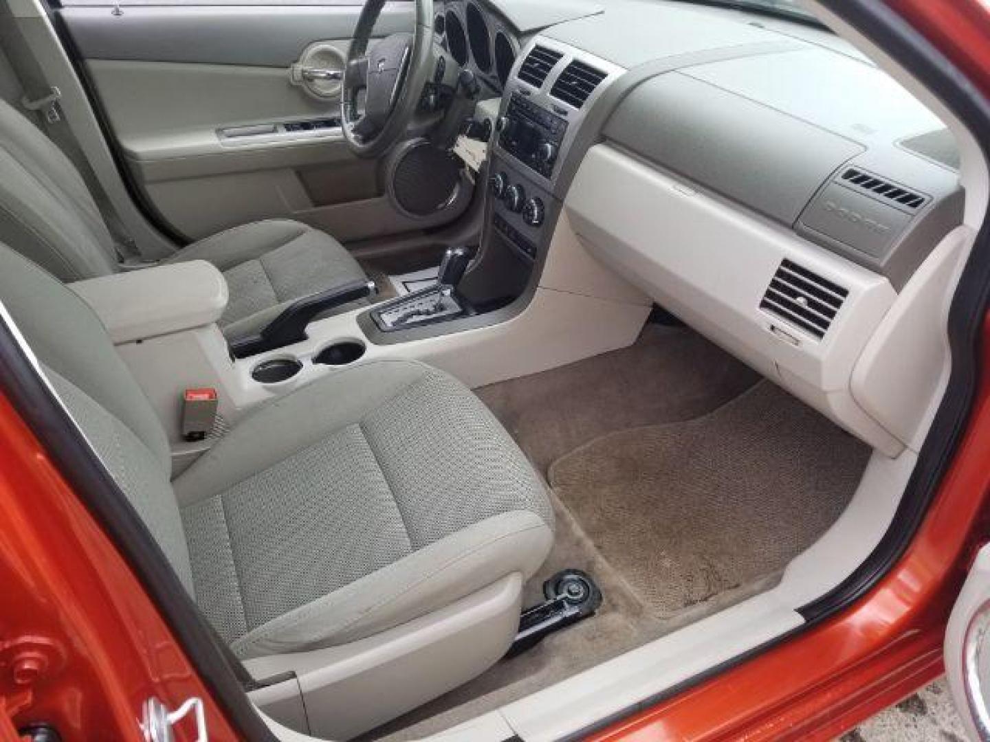 2008 Sunburst Orange Pear Dodge Avenger SXT (1B3LC56R08N) with an 2.7L V6 DOHC 24V FFV engine, 4-Speed Automatic transmission, located at 601 E. Idaho St., Kalispell, MT, 59901, (406) 300-4664, 0.000000, 0.000000 - Photo#10