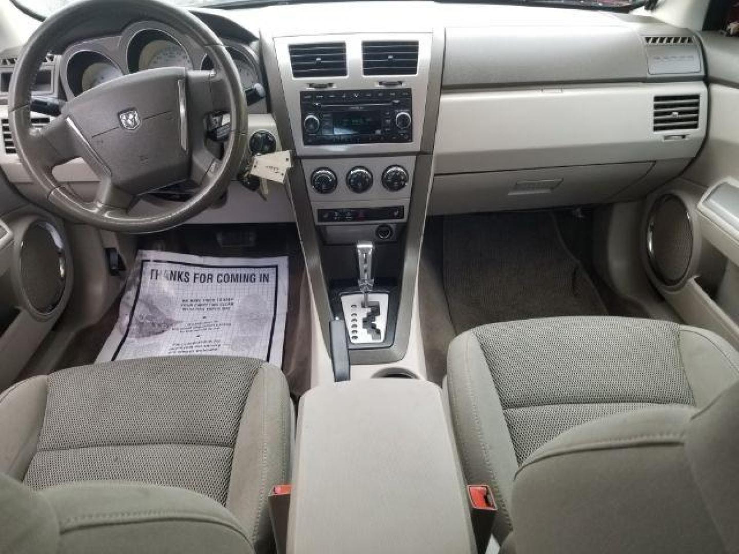 2008 Sunburst Orange Pear Dodge Avenger SXT (1B3LC56R08N) with an 2.7L V6 DOHC 24V FFV engine, 4-Speed Automatic transmission, located at 601 E. Idaho St., Kalispell, MT, 59901, (406) 300-4664, 0.000000, 0.000000 - Photo#11