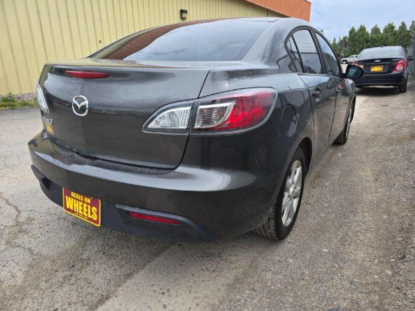 2011 Mazda MAZDA3 i Touring 4-Door (JM1BL1VF2B1) with an 2.0L L4 DOHC 16V engine, 5-Speed Manual transmission, located at 4047 Montana Ave., Billings, MT, 59101, 45.770847, -108.529800 - Photo#3